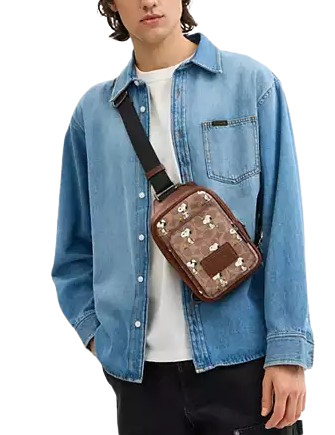 Coach Coach X Peanuts Racer Sling Pack In Signature Canvas Coach Coach X Peanuts Racer Sling Pack In Signature Canvas