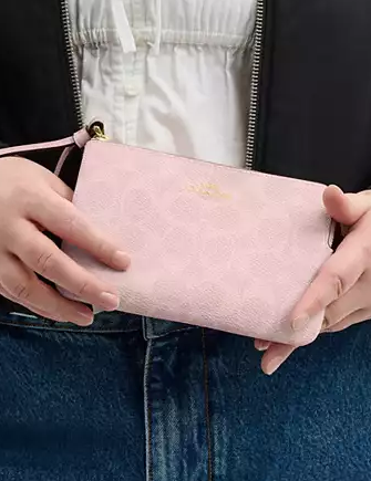 Coach Corner Zip Wristlet In Signature Canvas Powder Pink