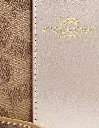 Coach Corner Zip Wristlet In Signature Canvas Tan Light Champagne