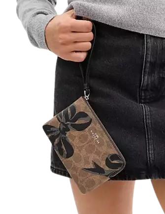 Coach Corner Zip Wristlet In Signature Canvas With Bow Print Tan Black
