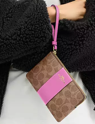 Coach Corner Zip Wristlet In Signature Canvas With Stripe Tan Fuchsia