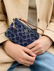 Coach Corner Zip Wristlet In Signature Denim