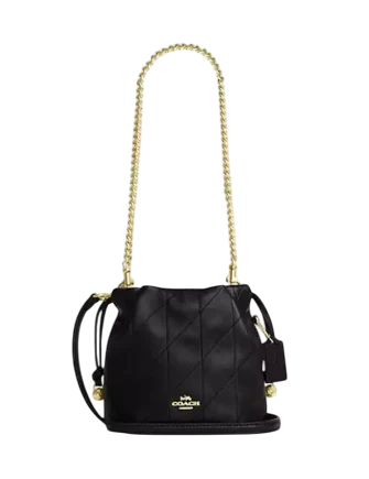coach faye mini backpack Drawstring Bag With Bows India Embossed logo and zippered expansion panels at face spin_cdb67_svbk_v2_p3