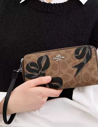 Coach Long Zip Around Wallet In Signature Canvas With Bow Coach Long Zip Around Wallet In Signature Canvas With Bow