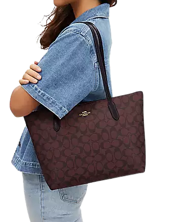 Coach zip top tote signature