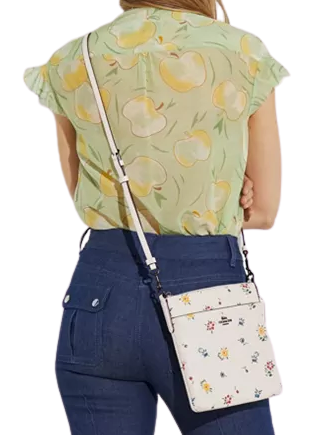 Kitt messenger crossbody with wildflower print hotsell