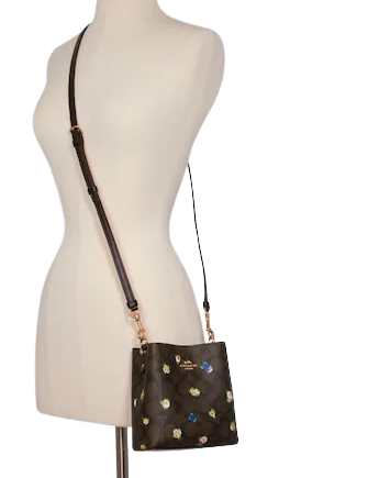 Disney x coach duffle 20 with spooky eyes print online