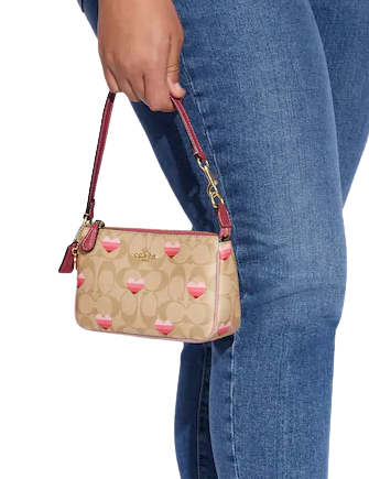 Nolita 19 in signature canvas with snowflake 2025 print