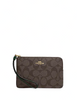 Coach Corner Zip Wristlet In Signature Canvas