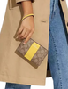 Coach Corner Zip Wristlet In Signature Canvas