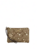 Coach Corner Zip Wristlet In Signature Canvas With Star And Snowflake Print