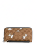 Coach Coach X Peanuts Long Zip Around Wallet In Signature Canvas With Snoopy Print