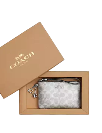 Coach Boxed Corner Zip Wristlet In Signature Canvas With Charms Silver