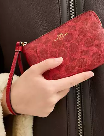 Coach Corner Zip Wristlet In Signature Canvas Bold Red