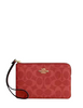 Coach Corner Zip Wristlet In Signature Canvas Crimson