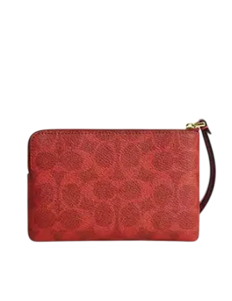 Coach Corner Zip Wristlet In Signature Canvas Crimson
