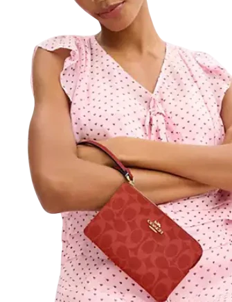 Coach Corner Zip Wristlet In Signature Canvas Crimson