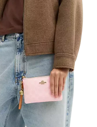  Coach Corner Zip Wristlet In Signature Canvas With Charms Powder Pink
