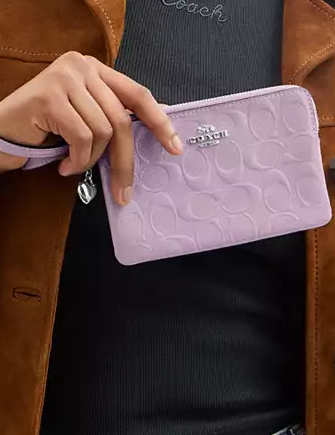 Coach Corner Zip Wristlet In Signature Leather With Heart Charm Light Violet 