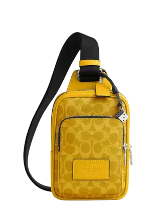Coach Racer Sling Pack In Signature Canvas With Charms