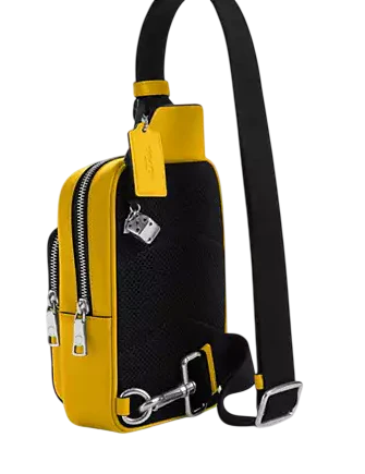 Coach Racer Sling Pack In Signature Canvas With Charms Canary