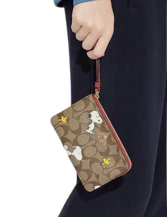Coach X Peanuts Corner Zip Wristlet In Signature Canvas With Snoopy Woodstock Print